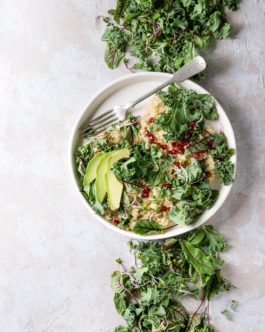 Kale-Quinoa Bowl with Avocado and Pomegranate | Plant-Based Recipe